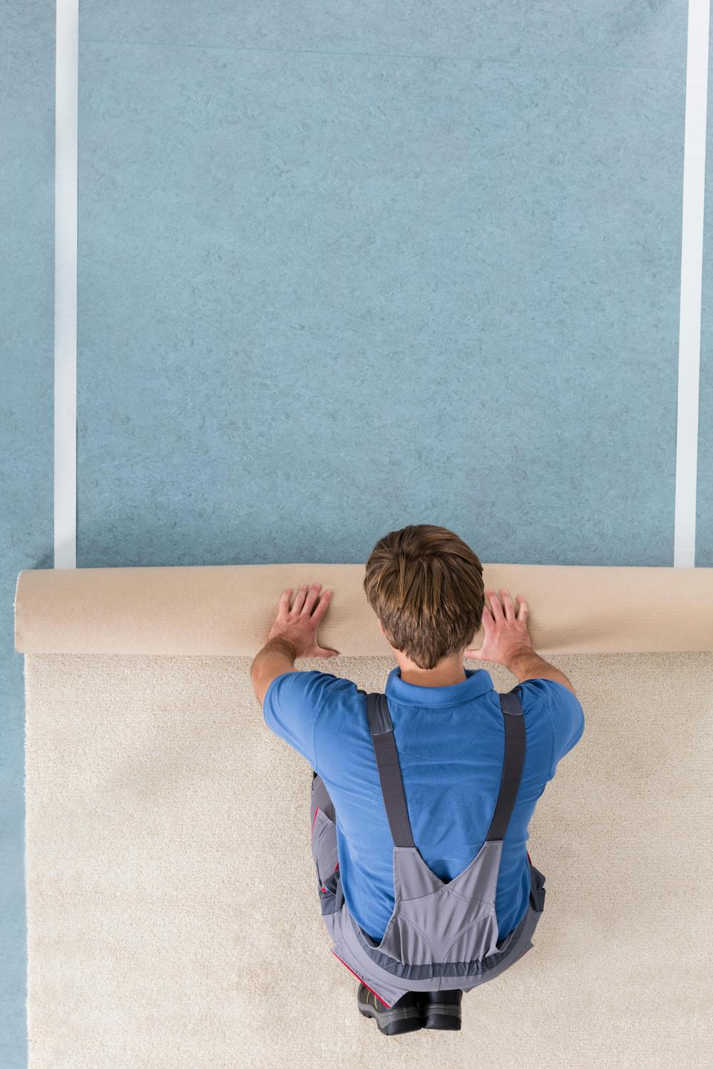 Remnant City carpet installer at work in a Pittsburgh home